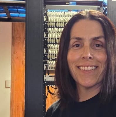 Ailyn, Founder of Ascend Networks, at a network installation in South Florida